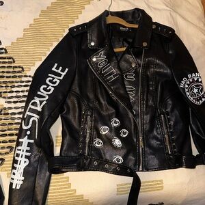 Woman’s cropped black leather jacket
